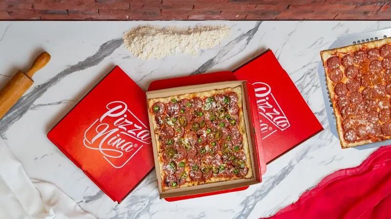 Square pepperoni pizza with jalapeños in a Pizza Nina box, Baghdad, Iraq